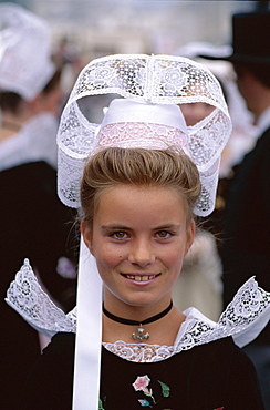 Portrait of a girl wearing lace headdress (coiffes) and Breton traditional dress, Brittany, France, Europe