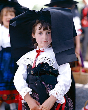 Girl dressed in regional costume with Alsatian headdress, Alsace, France, Europe