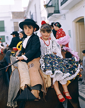 Girl and boy dressed in Andalucian costume at the Horse Fair (Fiesta), Jerez de la Frontera, Andalusia, Spain, Europe