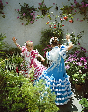 Girls dressed in Andalucian costume at the Horse Fair (Fiesta), Jerez de la Frontera, Andalusia, Spain, Europe