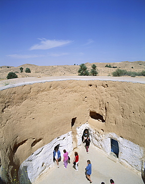 Tourists visiting underground Troglodyte dwellings, Matmata, Tunisia, North Africa, Africa