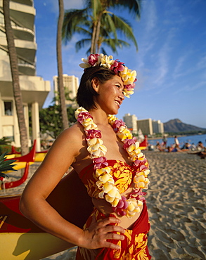 Hawaiian girl wearing leis on beach, Waikiki Beach and Diamond Head, Honolulu, Hawaii, Oahu, United States of America, North America