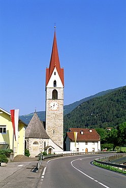 Road and church in Vandois Di Sofia village, Veneto, Dolomites, Italy, Europe