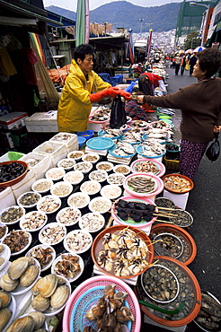 Woman buying seafood, Jagalchi Market, Busan, South Korea, Asia