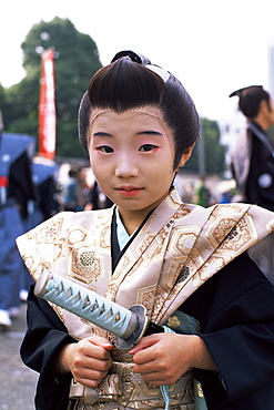 Boy dressed in Samurai costume at Jidai Matsuri Festival held annually in November at Sensoji Temple Asakusa, Tokyo, Honshu, Japan, Asia