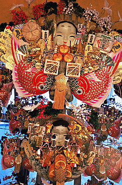 Decorative good luck rakes for sale at the Tori-no-Ichi Festival held annually in November at Otori Shrine, Tokyo, Honshu, Japan, Asia