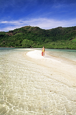 Girl walking on sand bar, Snake Island, El Nido, Bascuit Bay, Palawan, Philippines, Southeast Asia, Asia