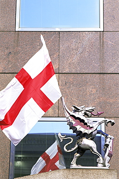 City of London dragon statue bearing Cross of St. George and holding flag of St. George, London, England, United Kingdom, Europe