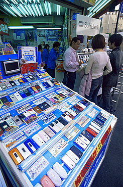 Customers at mobile phone store, Akihabara Electrical District, Tokyo, Japan, Asia