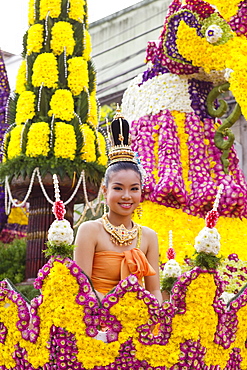 Girl on floral float at Chiang Mai Flower Festival Parade, Chiang Mai, Thailand, Southeast Asia, Asia