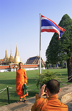 Monks taking photos at Wat Phra Kaeo, Bangkok, Thailand, Southeast Asia, Asia