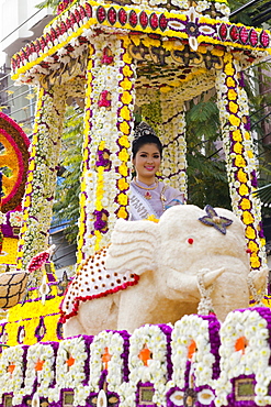 Girl on floral float at Chiang Mai Flower Festival Parade, Chiang Mai, Thailand, Southeast Asia, Asia