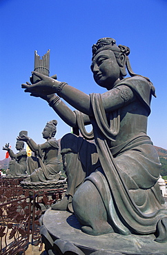 Chinese goddess statues at the base of the Giant Buddha Statue at Po Lin Monastery, Lantau, Hong Kong, China, Asia