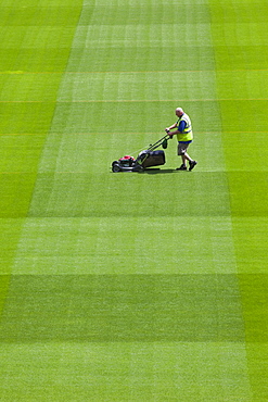 Greenkeeper mowing playing field in the Aviva Stadium in Landsdowne Road, Dublin, Republic of Ireland, Europe