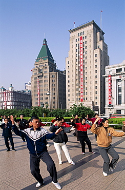 People doing Tai-chi on the Bund, Shanghai, China, Asia