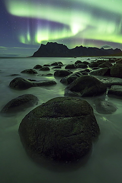 Aurora borealis (Northern Lights) over a mountain at Uttakleiv, Lofoten Islands, Arctic, Norway, Scandinavia, Europe