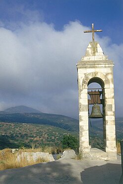 Photograph of a bell tower with a cross on it near the ruins of Baram in the Upper Galilee, Israel