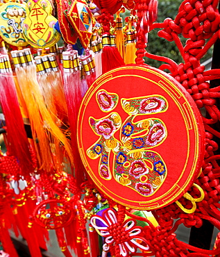 Auspicious Chinese word fu (good fortune) embroidered on a Chinese New Year ornamental souvenir, Chongqing, Sichuan, China, Asia