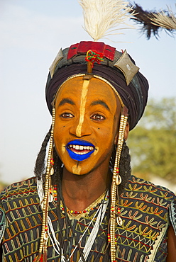 Wodaabe (Bororo) man with his face painted at the annual Gerewol male beauty contest, a general reunion of West African Wodaabe Peuls (Bororo Peul), Niger, West Africa, Africa