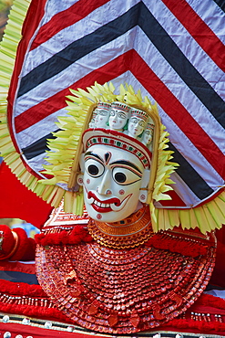 Man in costume representing a god at the Teyyam ceremony, near Kannur, Kerala, India, Asia