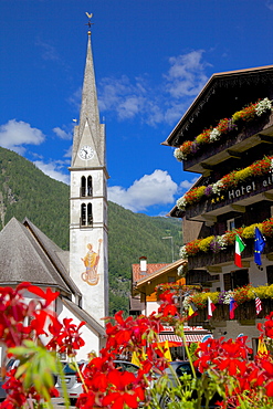 Church and hotel, Alleghe, Belluno Province, Italian Dolomites, Italy, Europe