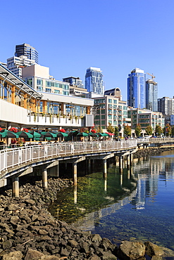 Seattle skyline and restaurants on sunny day in Bell Harbor Marina, Seattle, Washington State, United States of America, North America