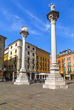 Two columns in Piazza dei Signori, one bearing the Venice Lion, the other with St. Theodore, Vicenza, Veneto, Italy, Europe