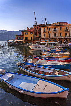 View of boats in Malcesine Harbour by the Lake, Malcesine, Lake Garda, Veneto, Italian Lakes, Italy, Europe