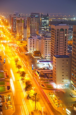 City skyline and Rashid Bin Saeed Al Maktoum Street at dusk, Abu Dhabi, United Arab Emirates, Middle East 