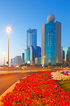 Contemporary architecture on Rashid Bin Saeed Al Maktoum Street at dusk, Abu Dhabi, United Arab Emirates, Middle East 