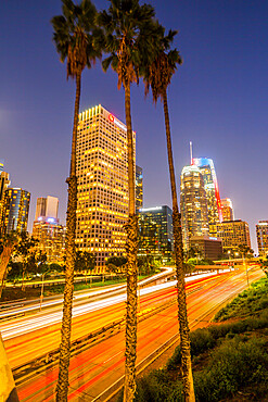 View of Downtown skyline and Harbour Freeway at dusk, Los Angeles, California, United States of America, North America