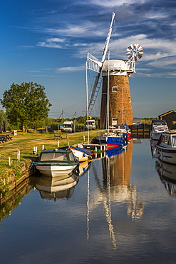 Boats and Horsey Mill reflecting in water, Norfolk Broads, Norfolk, England, United Kingdom, Europe