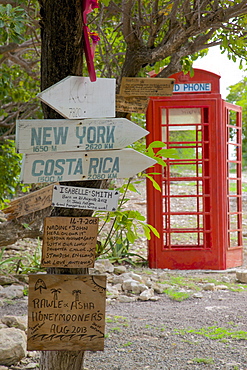 Red Telephone Box and signs at Mama Pasta's, Long Bay, Antigua, Leeward Islands, West Indies, Caribbean, Central America