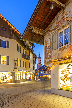 View of Parish Church of St. Martin and town shops at dusk, Garmisch-Partenkirchen, Bavaria, Germany, Europe