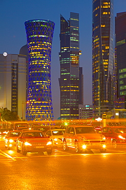 Contemporary architecture and traffic at dusk in the City Centre, Doha, Qatar, Middle East