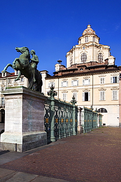 Statue and railings in Piazza Reale with San Lorenzo Church, Turin, Piedmont, Italy, Europe