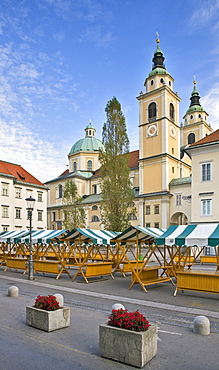 Market stalls in front of the Cathedral of St. Nicholas in Ljubljana, Slovenia, Europe