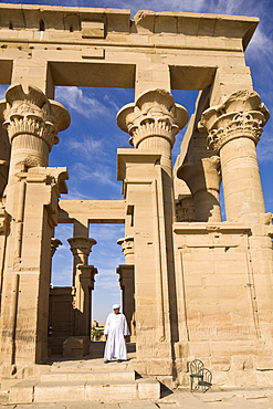 Man in white jellabiya in front of the Kiosk of Trajan at the Philae Temples, UNESCO World Heritage Site, Nubia, Egypt, North Africa, Africa