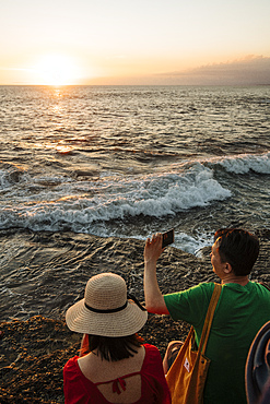 Tourists enjoying sunset at Tanah Lot Temple, Bali, Indonesia, Southeast Asia, Asia