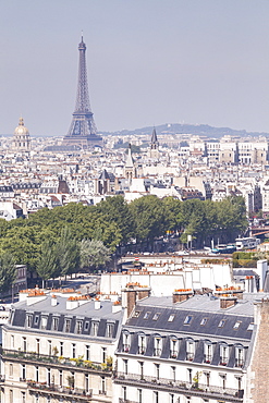 The Eiffel Tower over the rooftops of Paris, France, Europe