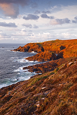 Looking towards Pendeen lighthouse and watch on the Cornish coastline, Cornwall, England, United Kingdom, Europe