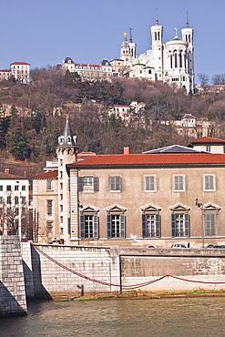 The waterfront in Old Lyon with the Basilica Notre Dame de Fourviere on the hill, Lyon, Rhone-Alpes, France, Europe 