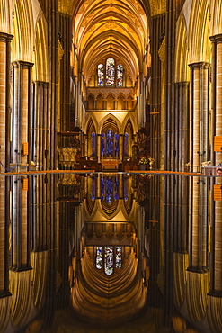 Looking across the font and down the nave of Salisbury Cathedral, Wiltshire, England, United Kingdom, Europe