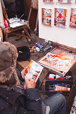 A street artist at work in the famous Place du Tertre in Montmartre, Paris, France, Europe