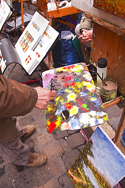 A street artist at work in the famous Place du Tertre in Montmartre, Paris, France, Europe