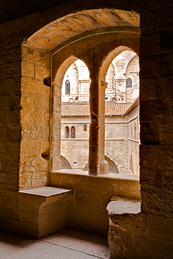 Looking through a window in the Palais de Papes, the palace home to the Sovereign Pontiffs in the 14th century, UNESCO World Heritage Site, Avignon, Vaucluse, France, Europe