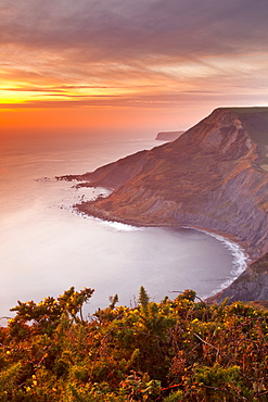 A beautiful sunset over Chapman's Pool on Dorset's Jurassic Coast, UNESCO World Heritage Site, Dorset, England, United Kingdom, Europe