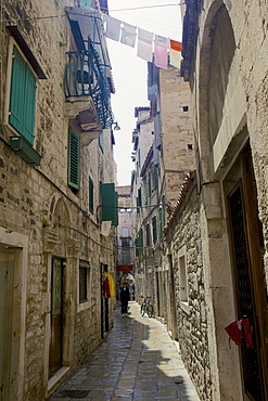 Back street with traditional stone buildings in Split, Croatia, Europe 