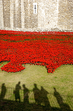 Shadows of people viewing Blood Swept Lands and Seas of Red installation at The Tower of London marking 100 years since the First World War, London, England, United Kingdom, Europe