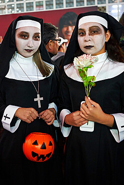 Young Japanese girls dressed as nuns at the Halloween celebrations in Shibuya, Tokyo, Japan, Asia